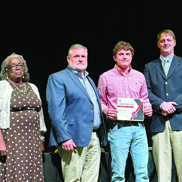 Morgan County High School student Mason Nunn (center) is recognized by the Morgan County Board of Education Nov. 11 for being the National FFA winner in grain production proficiency. HANNAH BARRON/Staff