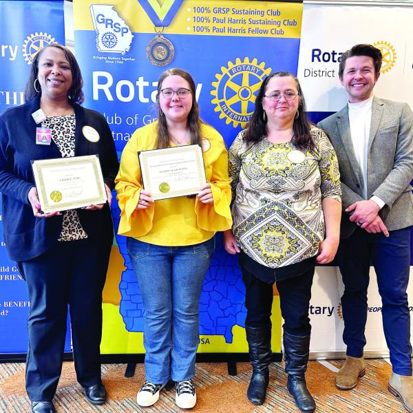 L-R: Dr. Candice Veal, Claudia Franklin,and Wanda Nix of Putnam County High School pose with Dr. Tyler Franks. CONTRIBUTED