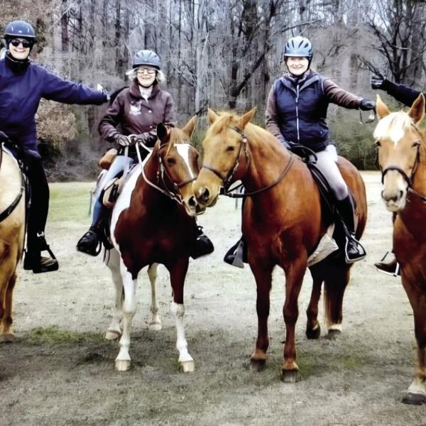 Kel-Mac Saddle Club members (l-r) Lori Williams, Jeanne Barsanti, Dayle Faulkner, and Susan McCullar briefly pose for a photo during a ride together. CONTRIBUTED