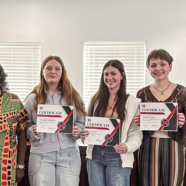 State literary girls’ trio runners-up (at center, l-r) Annabel Sparrow, Sora Rose, and Aaron Cooper are recognized by the Morgan County Board of Education. HANNAH BARRON/Staff