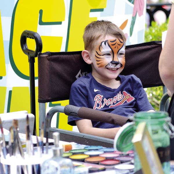 This young Braves fan is delighted with his new look. T. MICHAEL STONE/Staff