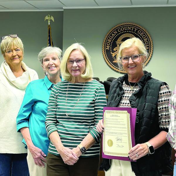 The Morgan County contingent of the Georgia Retired Educators Association receives a proclamation from the Morgan County Board of Commissioners designating Nov. 3 as Retired Educators Day. Pictured with the contingent during the BOC’s Oct. 15 meeting are District 1 commissioner and retired educator Donald Harris (far left) and board chairman Bill Kurtz (far right). HANNAH BARRON/Staff