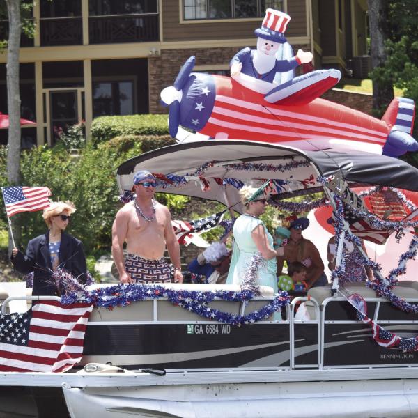 The Massey family, of Morgan County, was awarded the Most Patriotic vessel at the sixth-annual Lake Oconee boat parade. T. MICHAEL STONE/Staff