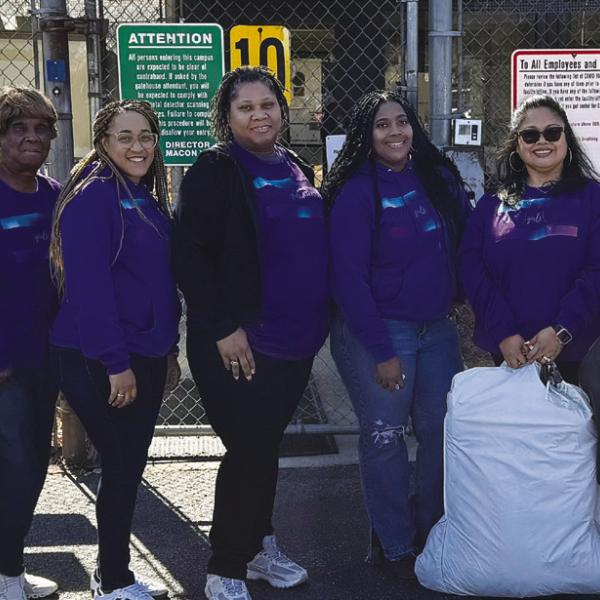 Reasha Daniels (third from right) and several other Putnam County women recently visited a youth detention center for girls in Macon to distribute dresses for a Valentine’s Day dance. CONTRIBUTED