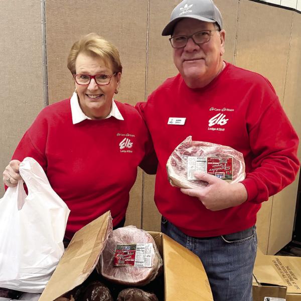 Volunteers prepare food for distribution. CONTRIBUTED