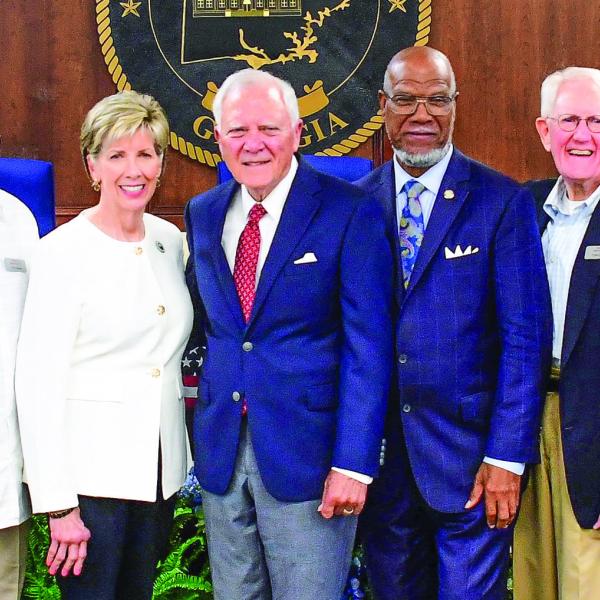 Members of Georgia Humanities posed with panelists Cathy Cox, Gov. Nathan Deal, and Legislator Calvin Smyre shortly before their discussion on democracy and the current condition of state and federal politics took place. IAN TOCHER/Staff