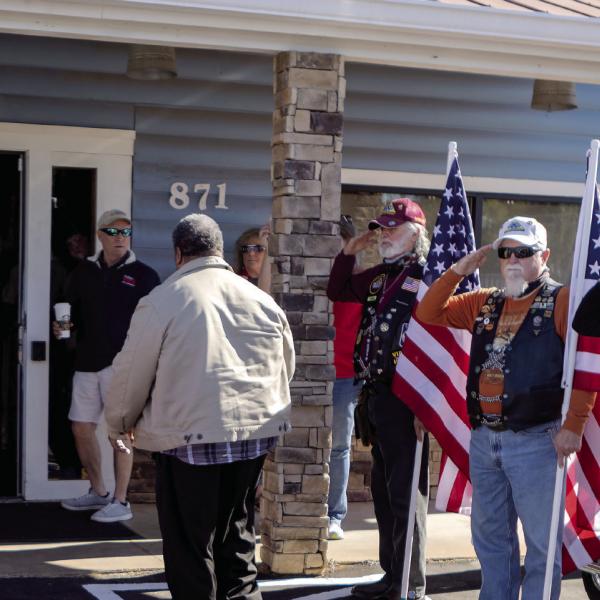 The Honor Flag line supports the wounded veterans as they arrive at the Elks Lodge. LEIGH LOFGREN/Staff