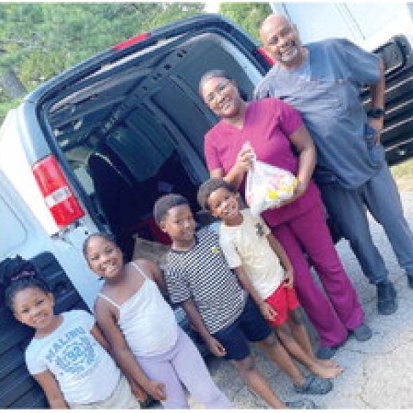Shanita Wright, director of nutrition for Greene County Schools helps deliver meals to local families in need. The Greene County School Nutrition Department has distributed more than 6,400 meals this month alone. (CONTRIBUTED)