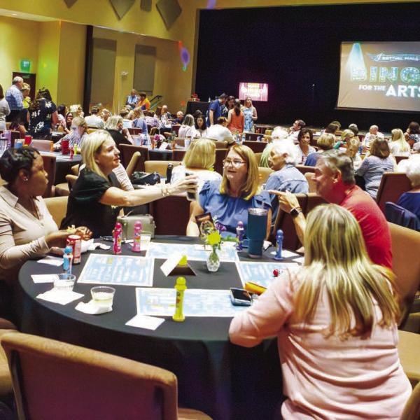 Participants are deep in concentration on the bingo cards as each number is announced. (LEIGH LOFGREN/Staff)