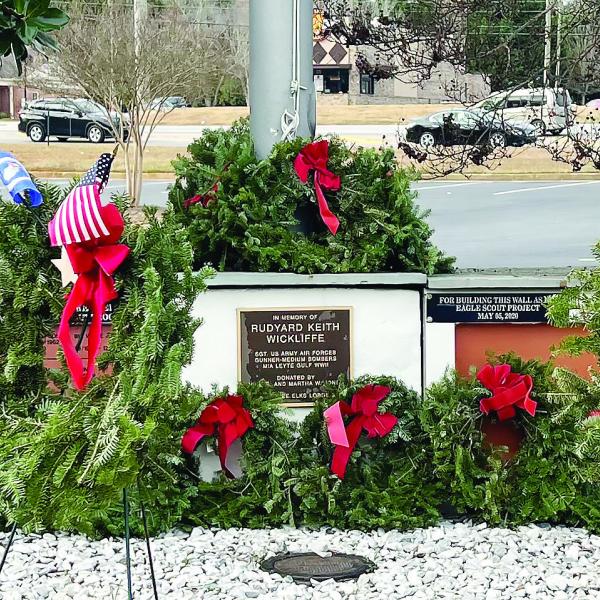 Wreaths in front of the Lake Oconee Lodge Veterans Wall.