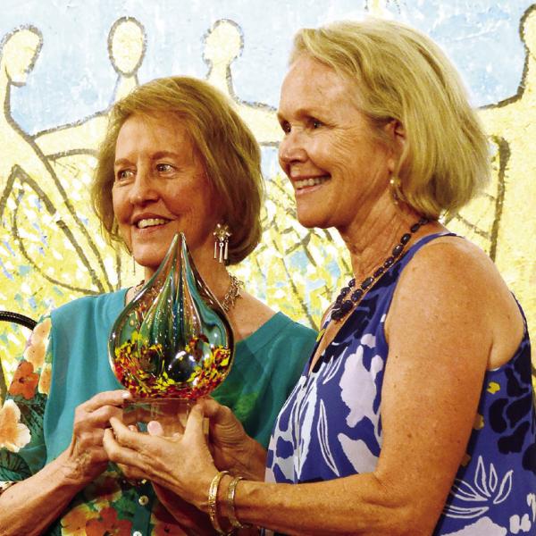 Retired MCMS art teacher Marjean Meadow (right) received a Charlie Bonner Award for Advancing Art Education from Lisa Thomas Conner. (IAN TOCHER/Staff)