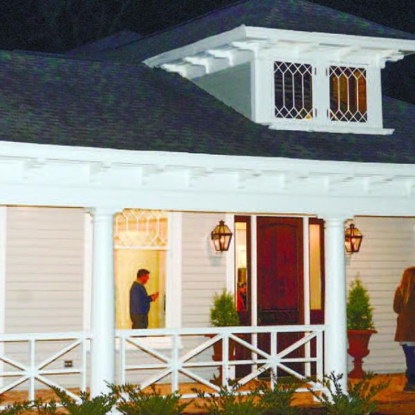 Curious visitors arrive on a cool November night last year to tour the recently refurbished home on Eatonton’s Wayne Street.
