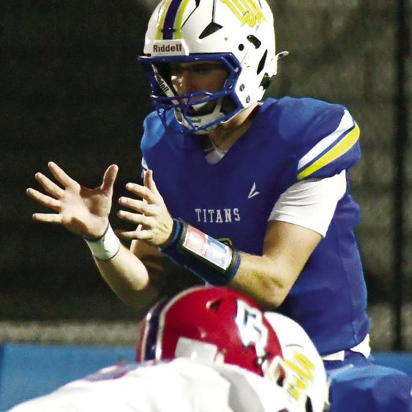 Titans junior quarterback Jake McDonald calling a snap in the team’s pre-season scrimmage at home in August. IAN TOCHER/Staff