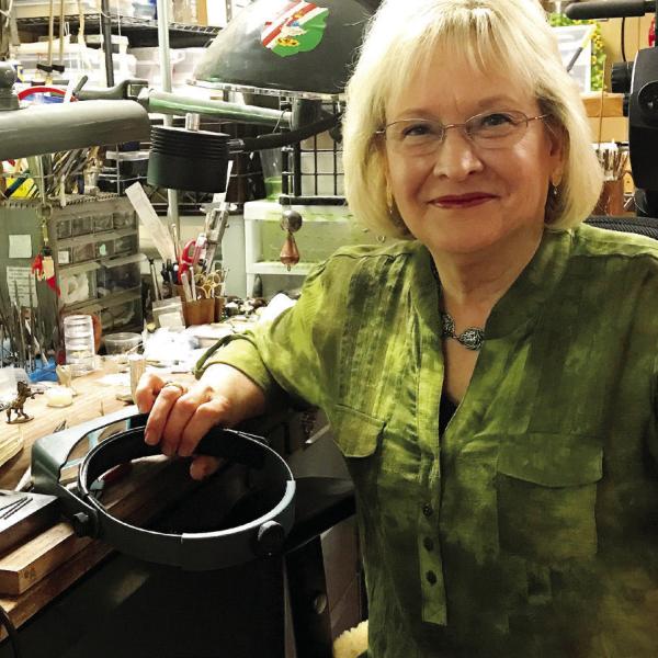 Georgia-based metal and jewelry artist Barbara Mann in her studio. CONTRIBUTED