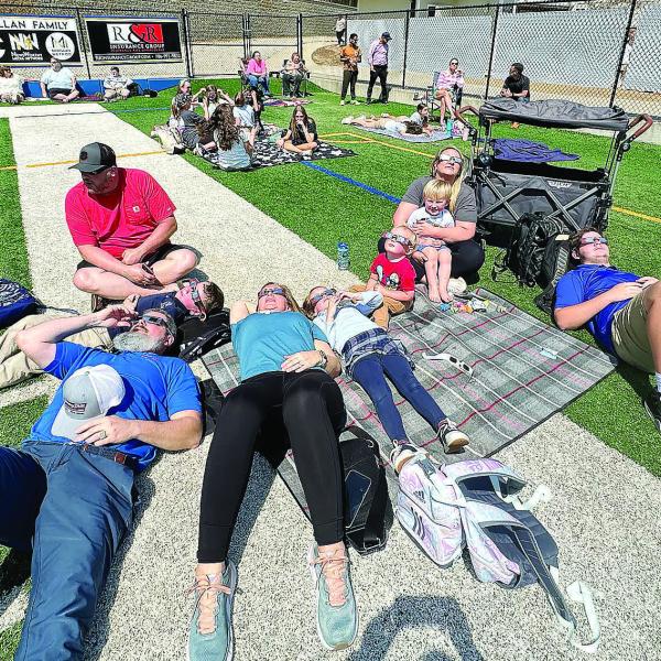 Parents and students turned out Monday for an eclipse watch party at LOA’s Tucker Field Monday. Above are the Dye, Parrish and Harris families.