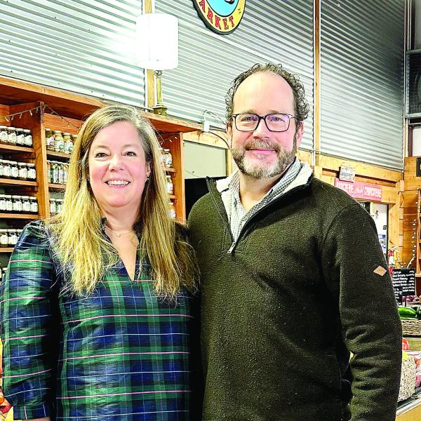 Whitney and Richard Lea of Greensboro at their new market location. MAUREEN STRATTON/Staff