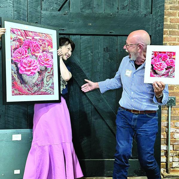 Artist Leslie Guo and photographer Lee Manis share a laugh over their contributions, both titled “Petite Roses.” CONTRIBUTED