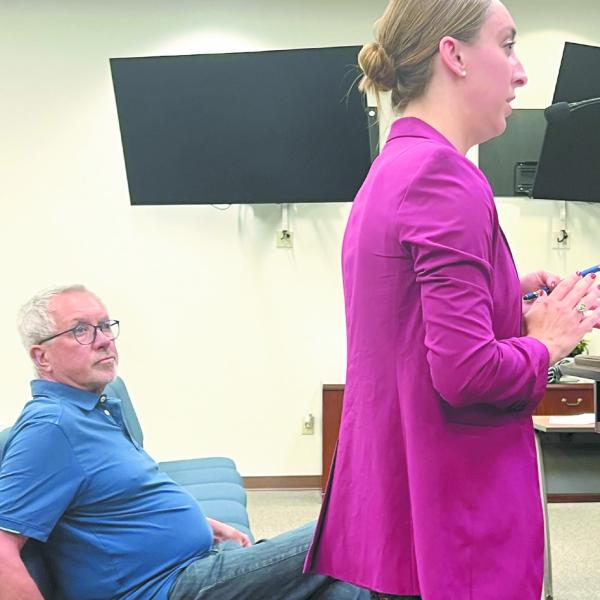 Eatonton-Putnam Chamber of Commerce CEO Maggie Milner makes a presentation about the upcoming sculpture trail to Eatonton City Council while her partner in the effort, Kevin Tomson-Hooper looks on. IAN TOCHER/Staff