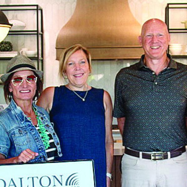 L-R: Candi White, Keri Dunn, Casey Jo Hanson, and Diana Risher of Dalton Carpet One, along with Patrick Kozma, Elaine Mathew, and Jan Broughton of Greene County Habitat for Humanity. CONTRIBUTED