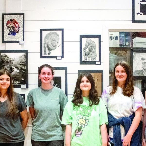 L-R: Karen Peters, MCHS students Lacey Blevins, Julia Maddox, Blake Sampson, Catie Malcome, Maggie Rogers, and MCHS art teacher Kristin Chandler attended the MAG’s Student Art Exhibition reception on Aug. 21. SKYLA MORRIS/Staff