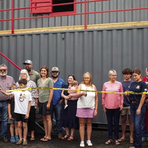 The MCFR named its new Fire Training Academy after former Morgan County Firefighters Chris Eddy, Chris McGlauchlen, and Keith Arnold. Their families cut the ceremonial ribbon on Monday morning in their honor. SKYLA MORRIS/Staff