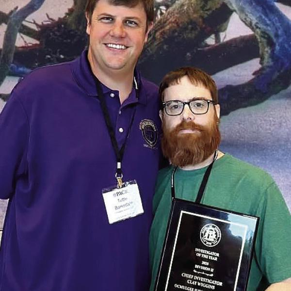 Investigator Clay Wiggins (right) and Ocmulgee Circuit District Attorney Wright Barksdale after the award was announced. CONTRIBUTED