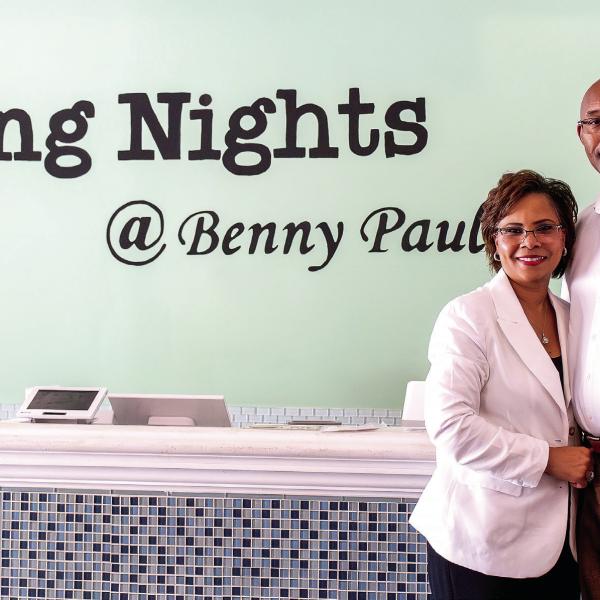 Brince and Emily Benford, owners of Wing Nights at Benny Paul’s, pose inside their restaurant in downtown Madison. The husband-and-wife team opened the business seven years ago and will celebrate five years at their current location in 2027. SKYLA MORRIS/Staff