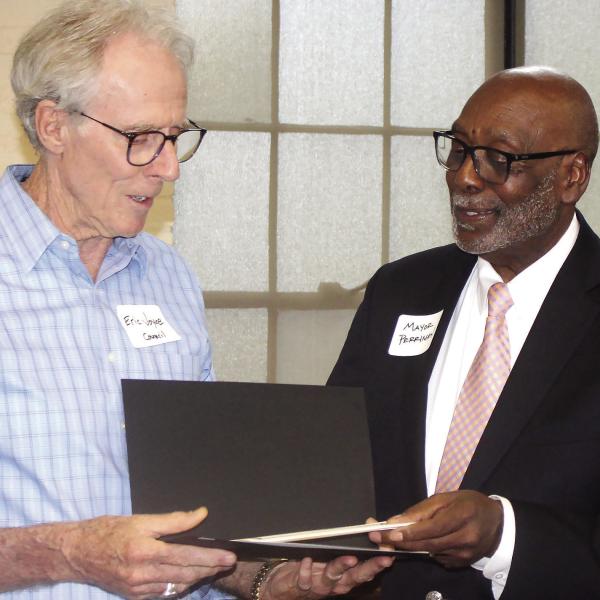 Erice Joyce receives the Volunteer of the Year award from Mayor Fred Perriman. (T. MICHAEL STONE/STAFF)