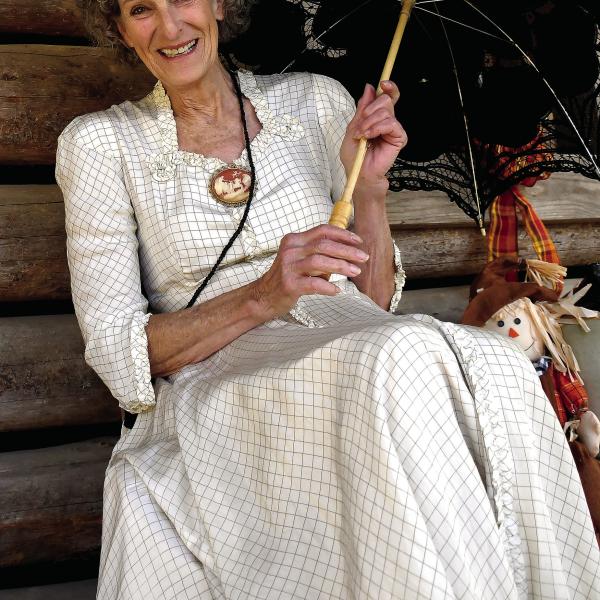 Virginia Linch of Butterflies and Blooms at the Briarpatch, welcomed guests to one of Stepback’s numerous log cabins. IAN TOCHER/Staff