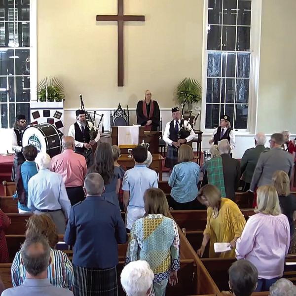 Bagpipers and drummers play a major role during the service. CONTRIBUTED