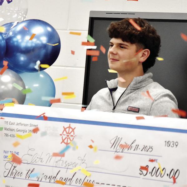 Morgan County High School junior Addison Hilsman is named the winner of the district-level Foundational Leadership and Entrepreneurship X-perience competition as confetti rains down. HANNAH BARRON/Staff