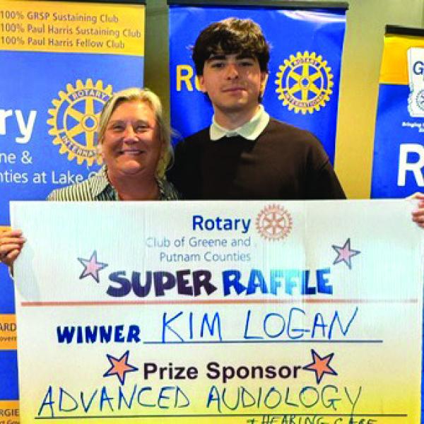 Rotarian and Rotary Area Governor Jennifer Pennington was joined by Rotary GRSP student Camilo Pareja of Columbia in presenting to Rotary Raffle Week 39 winner Kim Logan, who was not available for the photo, a pair of Apple AirPods and a fourpack of Apple AirTags valued at $350 total and sponsored by Advanced Audiology. CONTRIBUTED