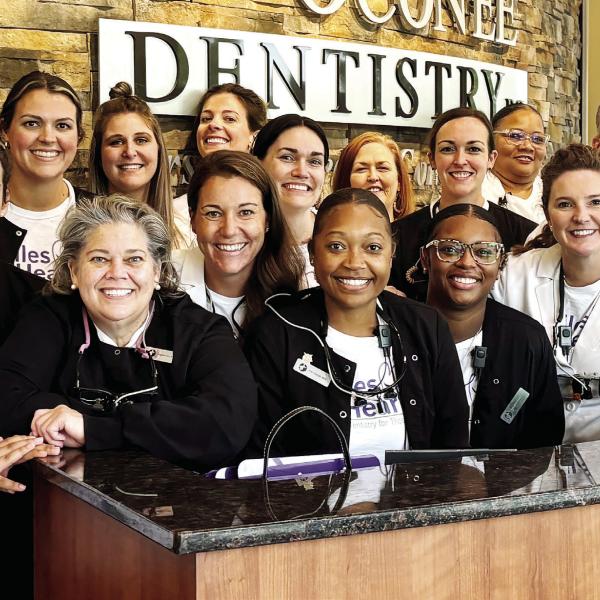 The team at Lake Oconee Dentistry during the annual Smiles from the Heart event Oct. 4. HANNAH BARRON/Staff