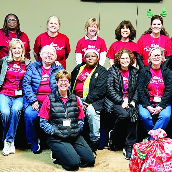 Victory Train volunteers work together to help spread Christmas cheer. CONTRIBUTED