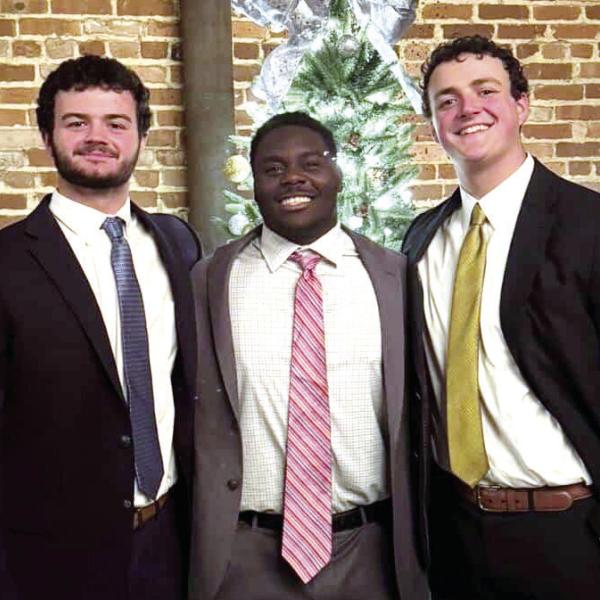 Morgan County senior Jatavious Ward (middle) is preparing to take a trip to Columbus to record his new documentary. His football teammates Harrison Mitchell (left) and Carter Mitchell (right), are tagging along to help him conduct interviews. CONTRIBUTED