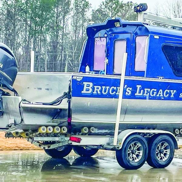 The Bruce’s Legacy boat is parked in the rain after owner Keith Cormican used it to locate the drowned body of Gary Jones on Lake Oconee. LYNN HOBBS/Staff