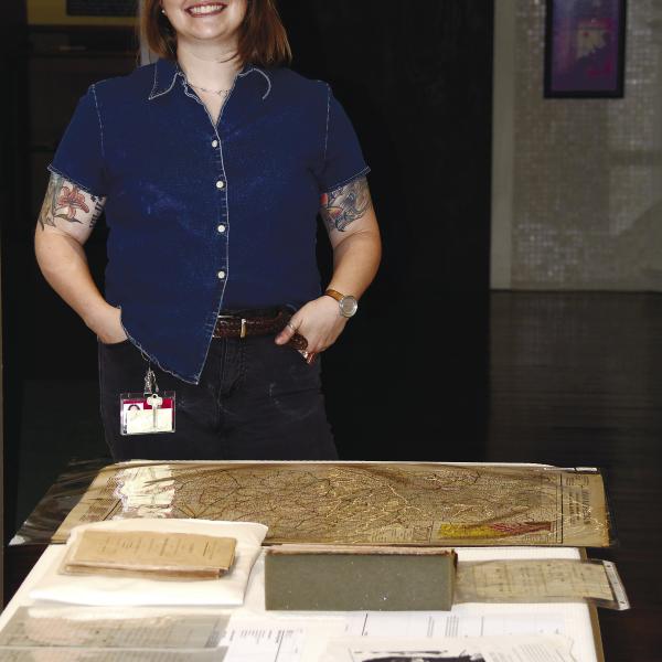 Kathryn Manis with the Hargrett Rare Books and Manuscripts Library displayed several unique Putnam County and Eatonton-related artifacts and publications during her one-day visit to Eatonton’s Old School History Museum. IAN TOCHER/Staff