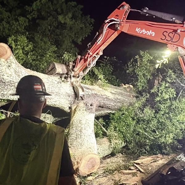 Putnam County Public Works crews clear trees from roadways after the storm. Tri-County EMC reported almost 5,000 meters were without power in Putnam and Jones counties. (Photo via social media)