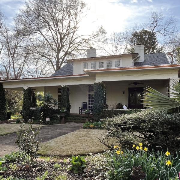 The WH Paul-Peeples house with its beautiful landscaping overtaking the front exterior view. CONTRIBUTED