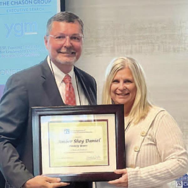 Madison-Morgan Chamber of Commerce President/CEO Shey Daniel (right) receives the Service Award from the Georgia Association of Chamber of Commerce Executives. CONTRIBUTED
