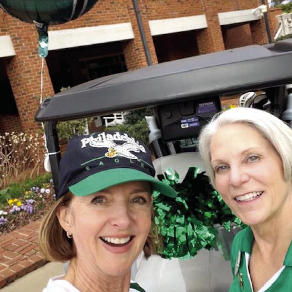 Nancy Simon (left) and Bonnie Snider cheer on the Philadelphia Eagles at The Preserve Course at Reynolds Lake Oconee. CONTRIBUTED