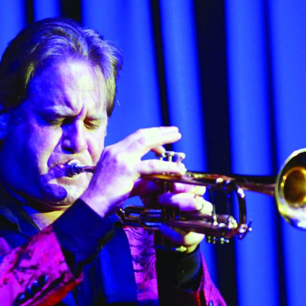 In addition to singing and leading the band, Gransden plays a mean trumpet. IAN TOCHER/Staff