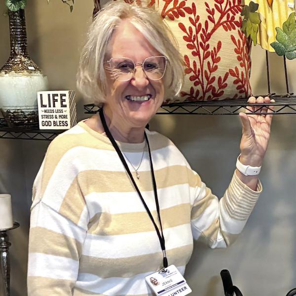 Volunteer Jeanie Wozniak poses with decorative and cooking items. CONTRIBUTED