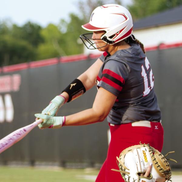 Morgan County’s Maeleigh Gibson swings at a pitch during the Dogs’ season-opening game against Walnut Grove. SKYLA MORRIS/Staff