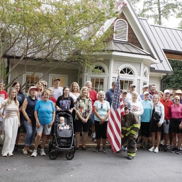 After the walk, participants got in line for a photo. (LEIGH LOFGREN/Staff)