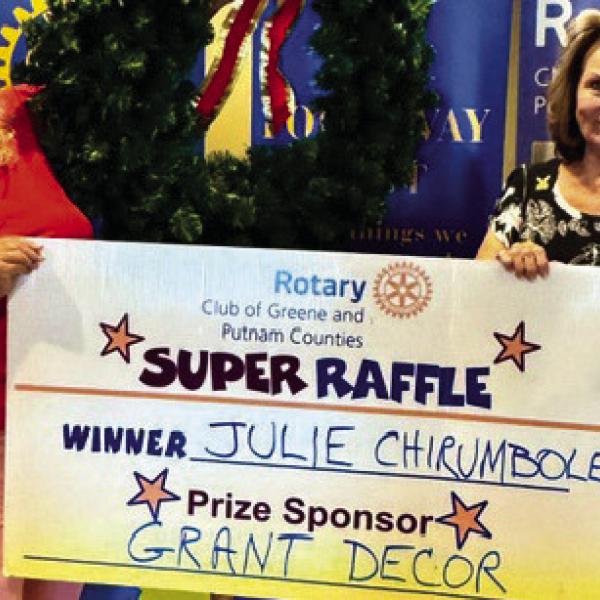 Rotary Raffle prize sponsor Leslie Grant of Grant Decor (left) poses with Rotarian Donna O’Neal in presenting a 36-inch Christmas wreath valued at $300 to Week 35 winner Julie Chirumbole, who was unavailable for the photo. CONTRIBUTED