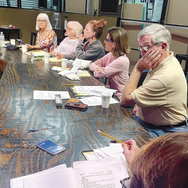 Actors ponder their lines as they rehearse together and prepare for the Nov. 9 opening of 12 Angry Jurors at The Plaza Arts Center. CONTRIBUTED