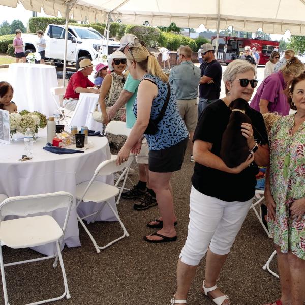 A large, open-sided tent provided much-needed shade and a place to sit down during the Lake Oconee Humane Society benefit event.