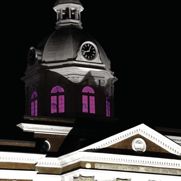The clock dome on the historic Putnam County courthouse is glowing purple throughout September in recognition of National Recovery Month. Organizer Laura Phillips also gave Chairman Bill Sharp and each county commissioner a purple lightbulb at the start of their Sept. 15 meeting. IAN TOCHER/Staff