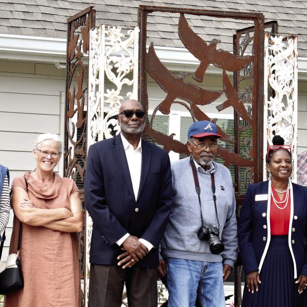 The City of Madison unveiled a sculpture commemorating the historic Jackson Center at Canaan Crossing Sept. 30. Pictured are representatives from apartment complex developer Woda Cooper Companies, the City of Madison, and sculptor Harold Rittenberry (center). (HANNAH BARRON/Staff)